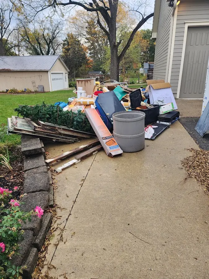Dumpster being loaded with debris for Residential Dumpster Rental in Jackson